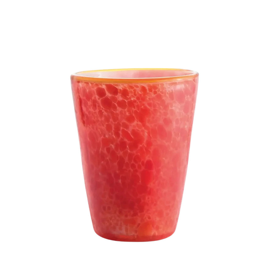 A textured red-orange glass tumbler with a marbled pattern and a gold rim, isolated on a white background.