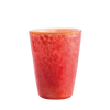 A textured red-orange glass tumbler with a marbled pattern and a gold rim, isolated on a white background.