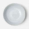 White ceramic bowl on a light gray background