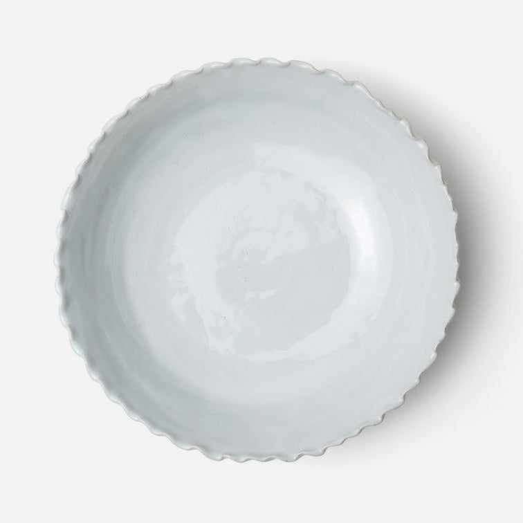 White ceramic bowl on a light gray background