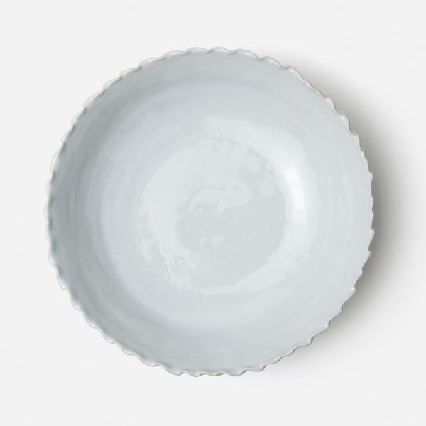 White ceramic bowl on a light gray background