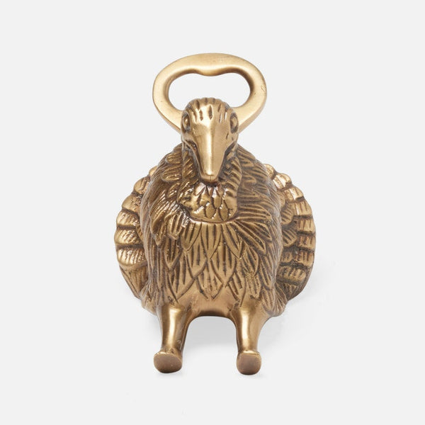 Brass bottle opener shaped like a turkey on a white background