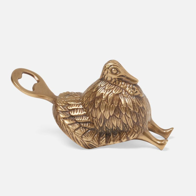 Bronze turkey-shaped bottle opener on a white background