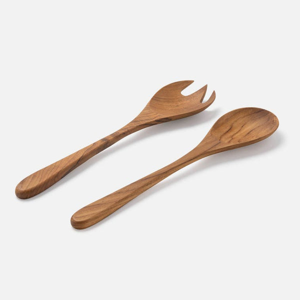 A wooden salad server set consisting of a serving fork and a serving spoon, made from natural wood with visible grain patterns, set against a clean off-white background.