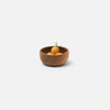 Brown wooden bowl with fruit inside on flat white background