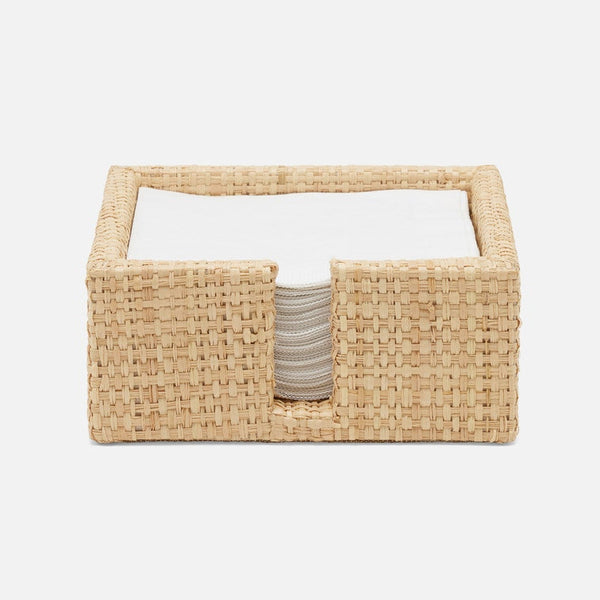 Woven rectangular napkin basket with a white interior on a light beige background