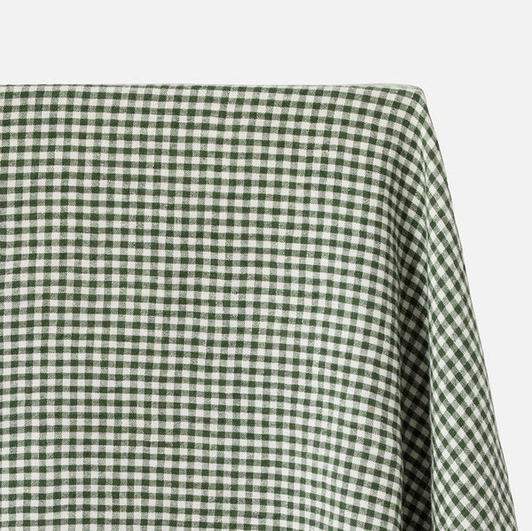 Close-up of green and white checkered table cloth on a white background