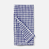 A folded cotton kitchen napkin with a classic navy blue and white gingham checkered pattern, shown on a clean light gray background.