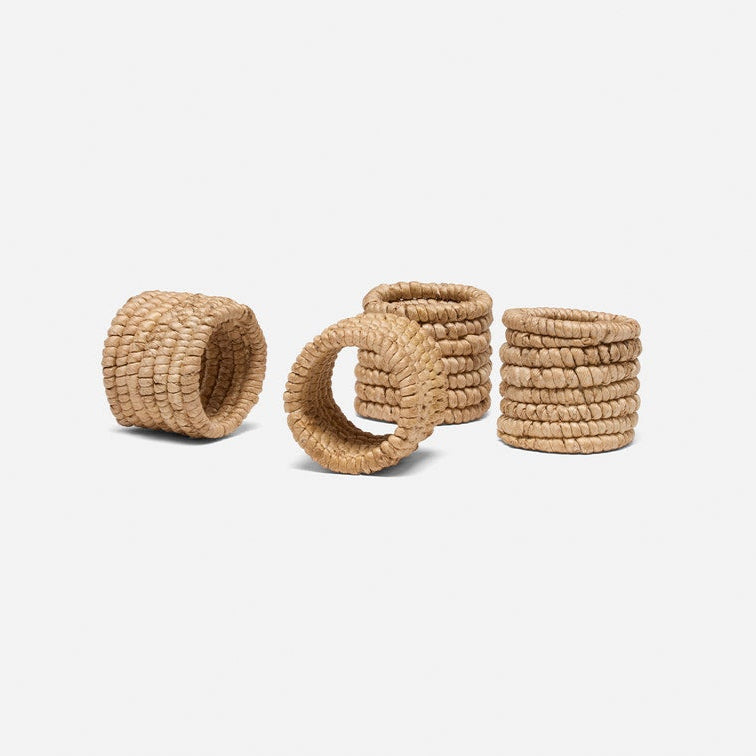 Set of woven napkin rings on a white background