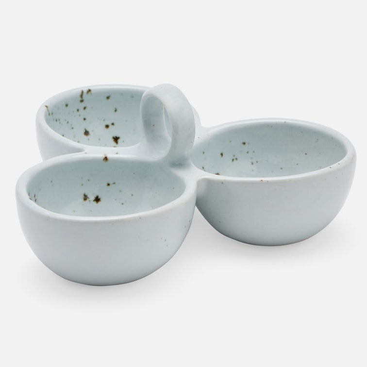 Three small stoneware bowls with a light blue-green glaze and dark speckles, arranged together on a plain white background.