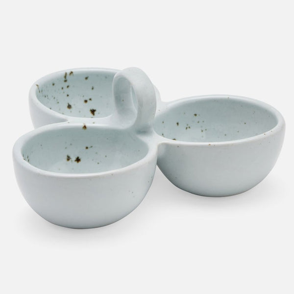 Three small stoneware bowls with a light blue-green glaze and dark speckles, arranged together on a plain white background.