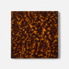 A square decorative coaster featuring a glossy tortoiseshell pattern in shades of dark brown and amber-gold, shown against a plain light gray background.