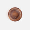 A round resin bowl with a swirling brown and amber pattern, photographed from directly above on a clean white background.