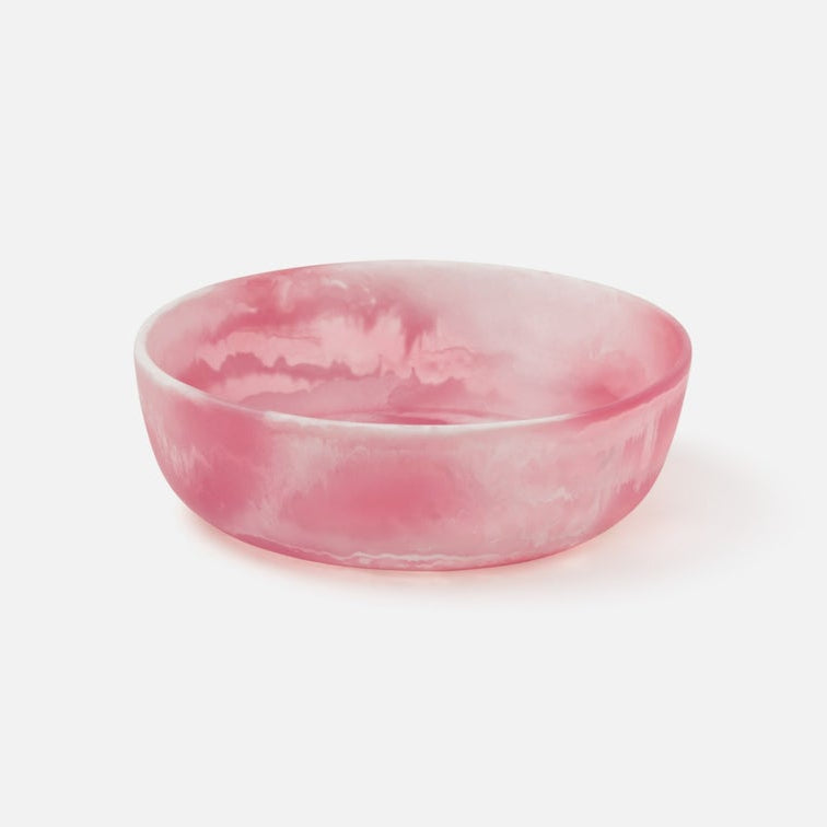 Pink resin bowl on a white background