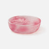 Pink resin bowl on a white background