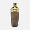 A cocktail shaker with a textured dark brown body featuring a chevron pattern and polished gold metal lid and collar, set against a light gray background.
