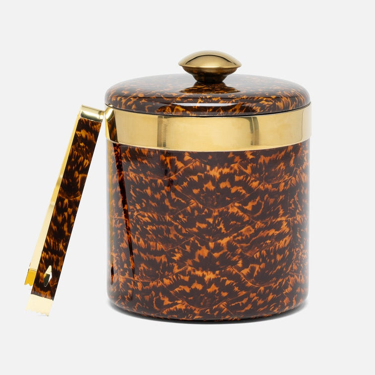 A cylindrical lidded ice bucket with a glossy tortoiseshell pattern in brown and amber, accented with a gold band and a matching gold-toned handle, shown on a light gray background.