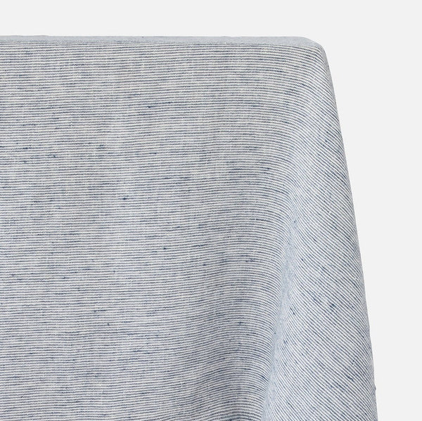 A close-up of a light gray heathered fabric with a fine horizontal ribbed texture, draped to show its drape and weave against a plain light gray background.