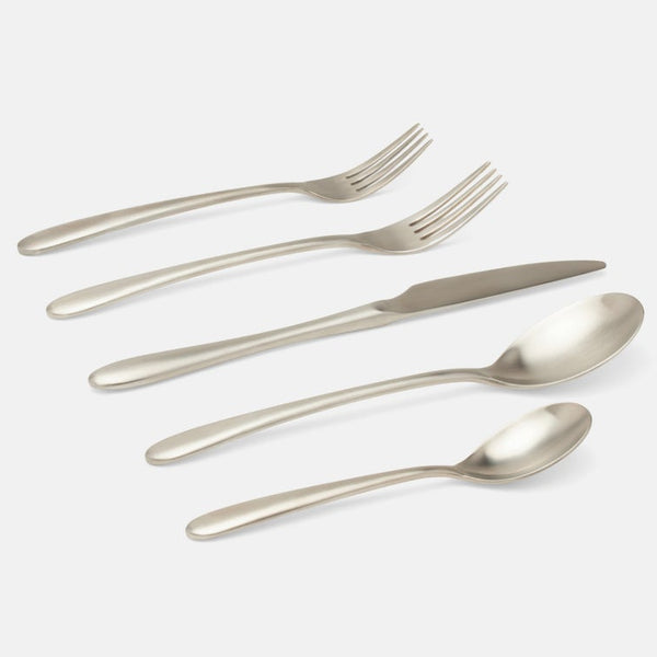 Five-piece stainless steel cutlery set including two forks, a knife, and two spoons, arranged diagonally on a light gray background.
