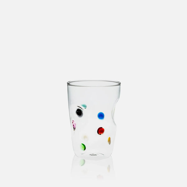 Clear glass with colorful dots on a white background