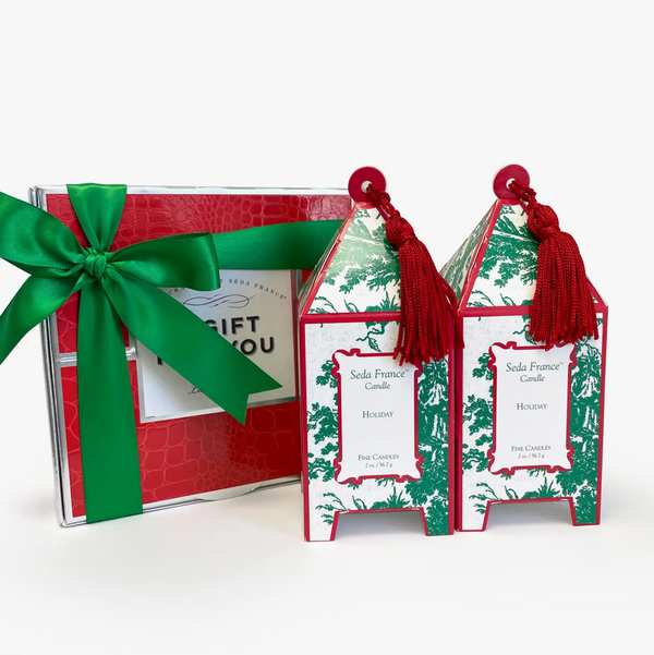 Two holiday mini pagoda candle gift sets with green and red decorations