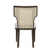A single dining chair shown from the back, featuring a dark brown wooden frame, a woven cane backrest, and light gray upholstered seat cushions, isolated on a white background.