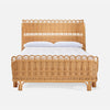 Wicker bed with decorative headboard and footboard on a white background