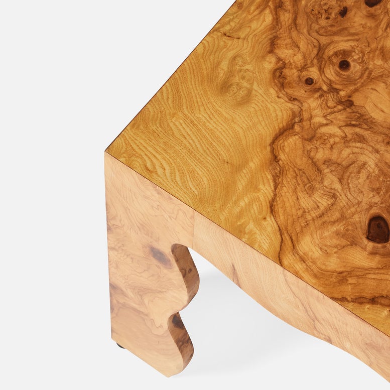 Close-up of a wooden table with a natural grain pattern on a white background
