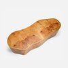 A handcrafted wooden coffee table with an organic, wavy shape, made from richly figured burl wood with a warm golden-brown finish and a polished gold-colored rim, shown on a light gray background.