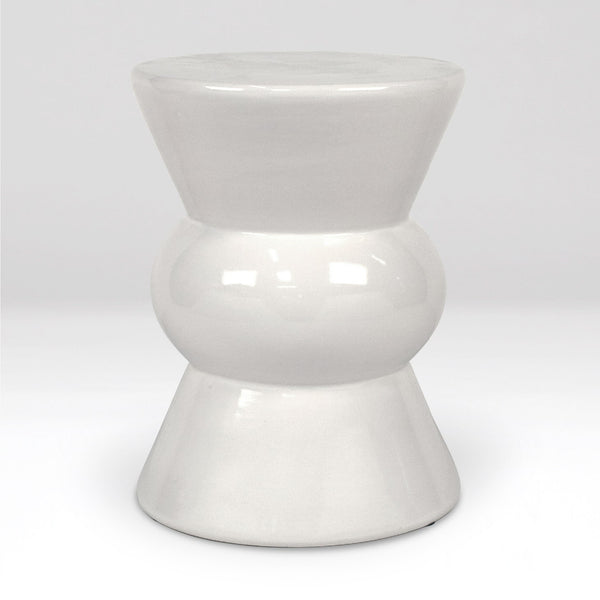 A glossy white ceramic stool with a tiered, hourglass-like design, photographed against a seamless light gray studio background.