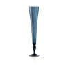 A tall, slender blue glass champagne flute  with a flared rim and a dark, turned stem leading to a round base, shown on a clean white background.
