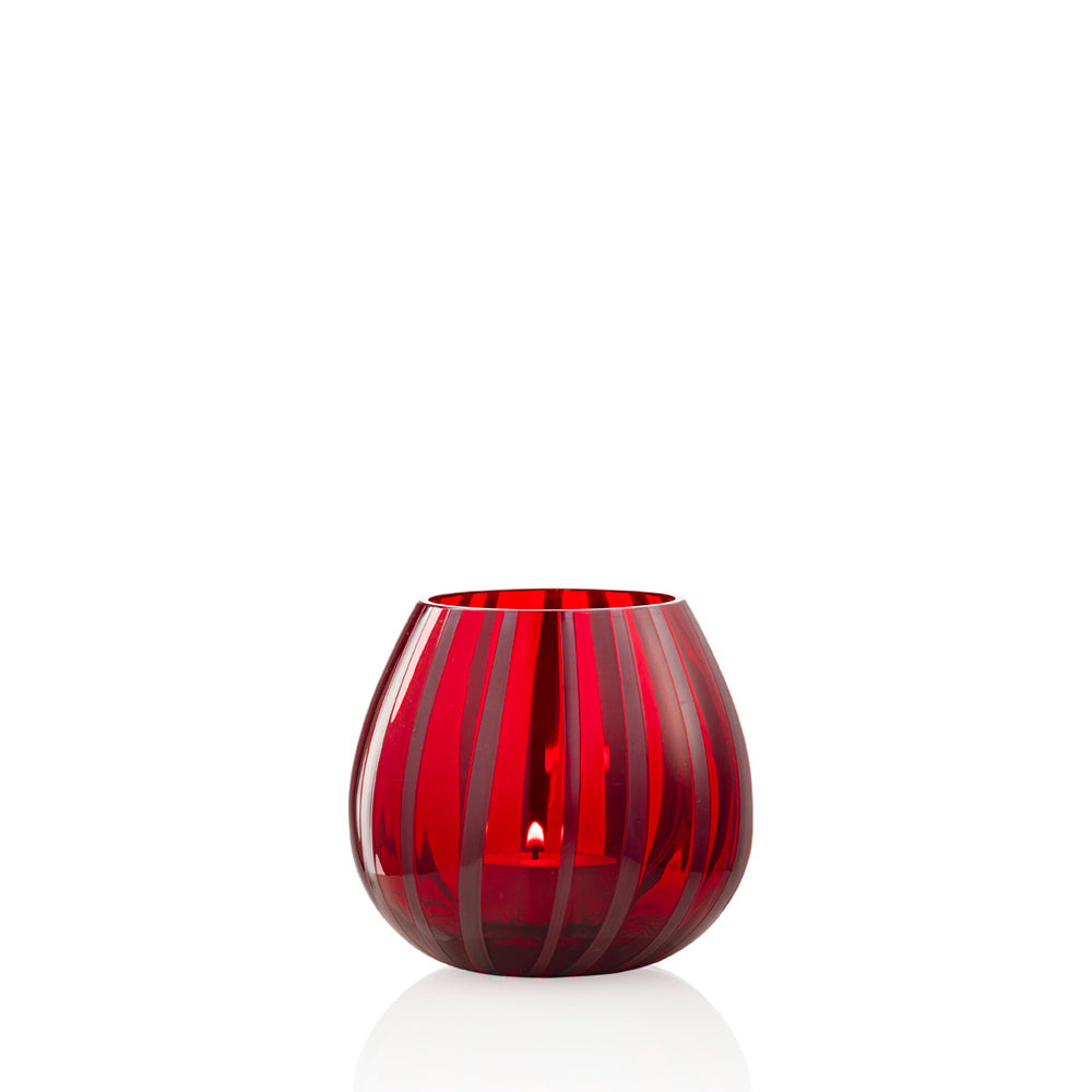Red and dark mauve striped glass tea light holder on white background