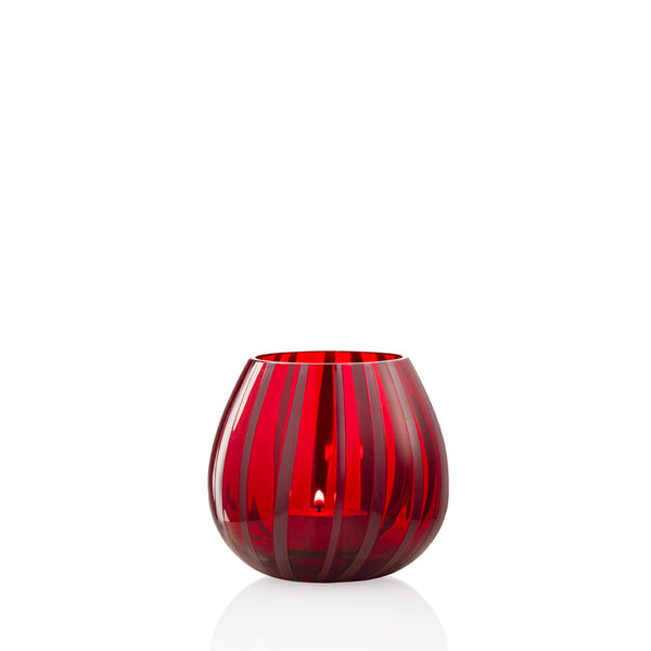 Red and dark mauve striped glass tea light holder on white background
