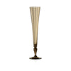 A tall, slender champagne flute made of brownish grey translucent glass with a flared rim and a dark, bulbous stem, centered on a plain white background.