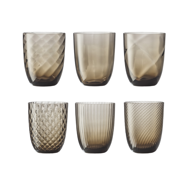Set of 6 brown varied water glasses on flat white background