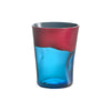 Red and blue water glass on flat white background