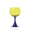 Wine glass with yellow top and blue stem on a white background