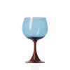 Blue wine glass with a red stem on a white background