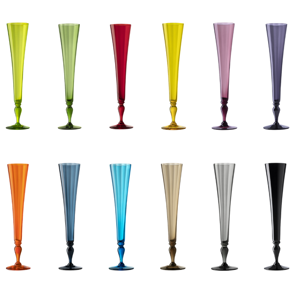 Twelve tall fluted stemware champagne flutes in assorted colors, arranged in two rows of six on a plain white background. The glasses include yellow-green, green, red, gold-yellow, lavender, orange, blue, dark blue, turquoise, champagne, and black.