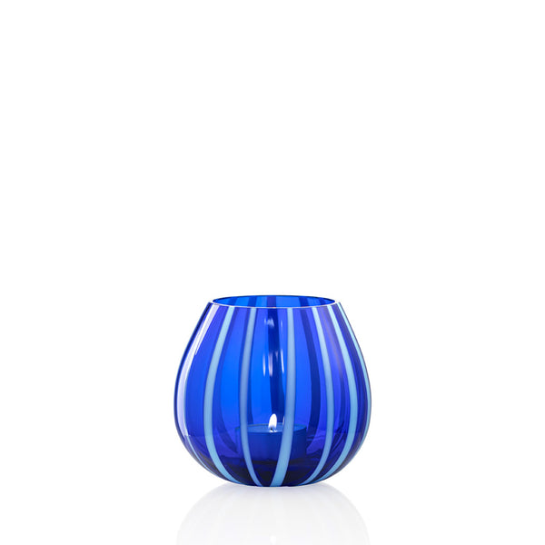 Light blue and cobalt blue striped glass tea light holder on white background