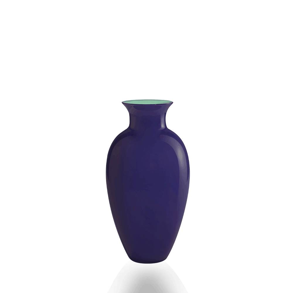 A glossy cobalt blue glass vase with a flared rim and a light green interior, shown on a clean white background with a soft reflection below.