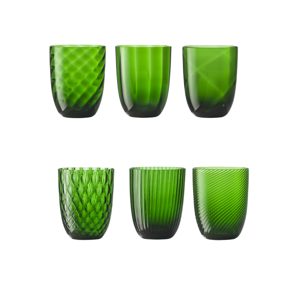 Set of  bright green water glasses on flat white background