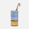 Colorful striped umbrella stand with a brown handle on a white background