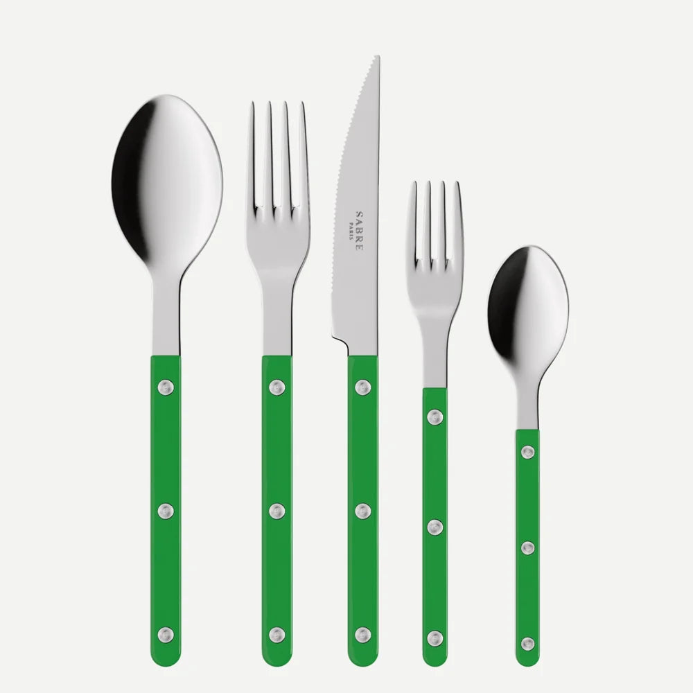 Set of silver cutlery with green handles on a white background