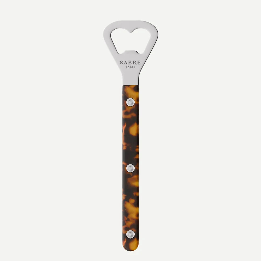 Bottle opener with tortoiseshell handle and silver accents on a white background