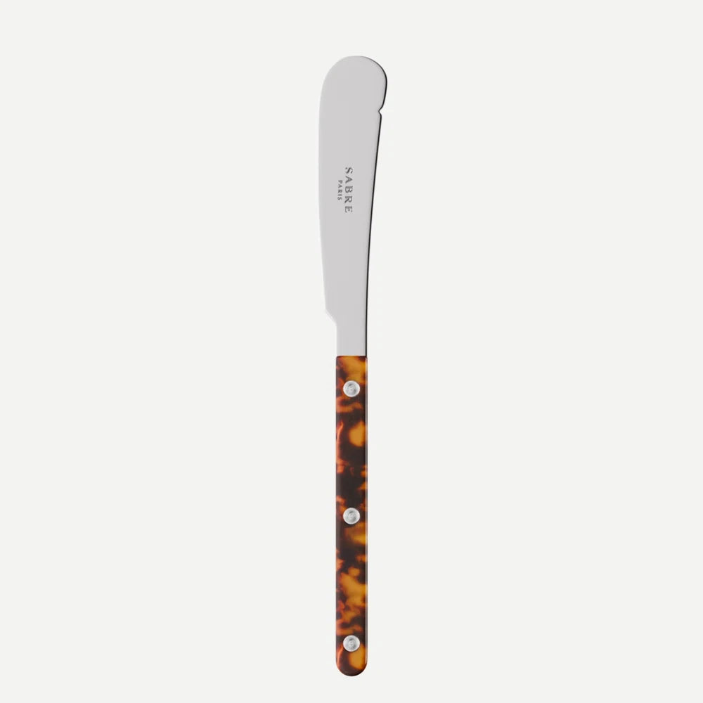 Stainless steel butter knife with tortoiseshell handle on a white background