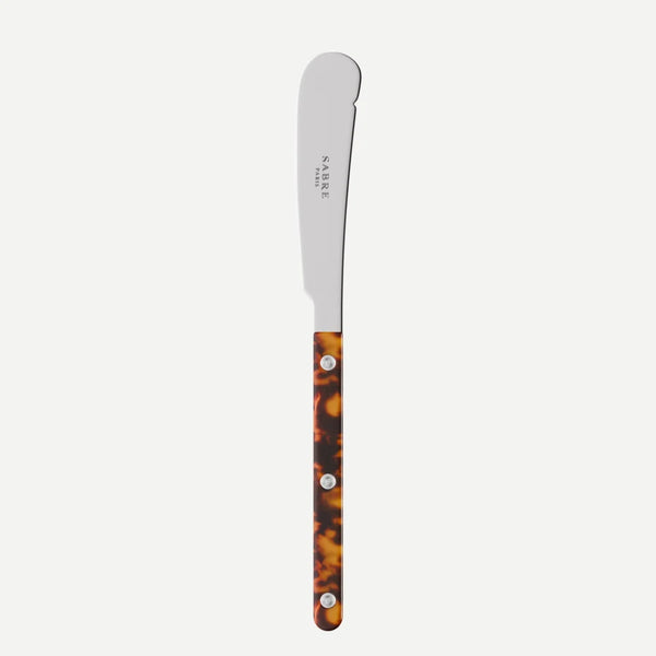 Stainless steel butter knife with tortoiseshell handle on a white background