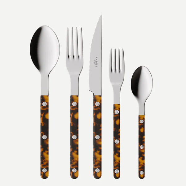 Five-piece cutlery set with polished silver-tone stainless steel heads and tortoiseshell-patterned handles, arranged vertically on a light gray background. The handles feature a mottled brown and amber pattern with silver rivets.