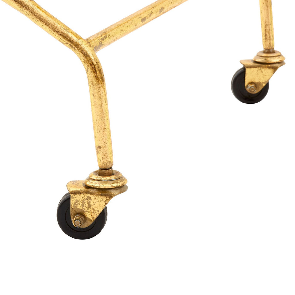 Gold metal frame with black wheels on a white background