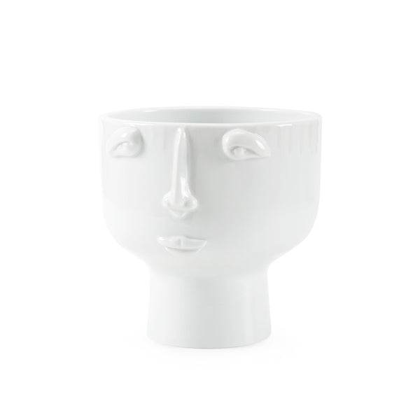 White ceramic face-shaped vase on a white background